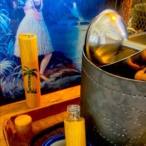 Tropical perfume 🌺 in a bamboo bottle that is hand-painted. 🌴